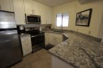 Stainless steel appliances and glass cook top